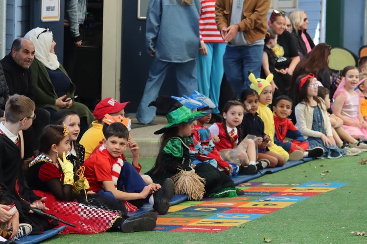 Students sitting at a Book Week Parade