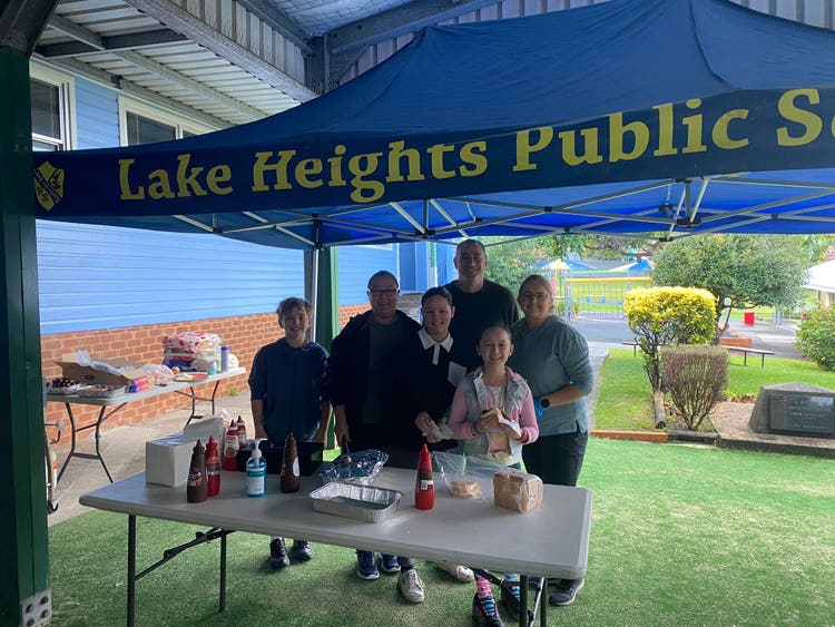 P and C Members standing at a barbeque